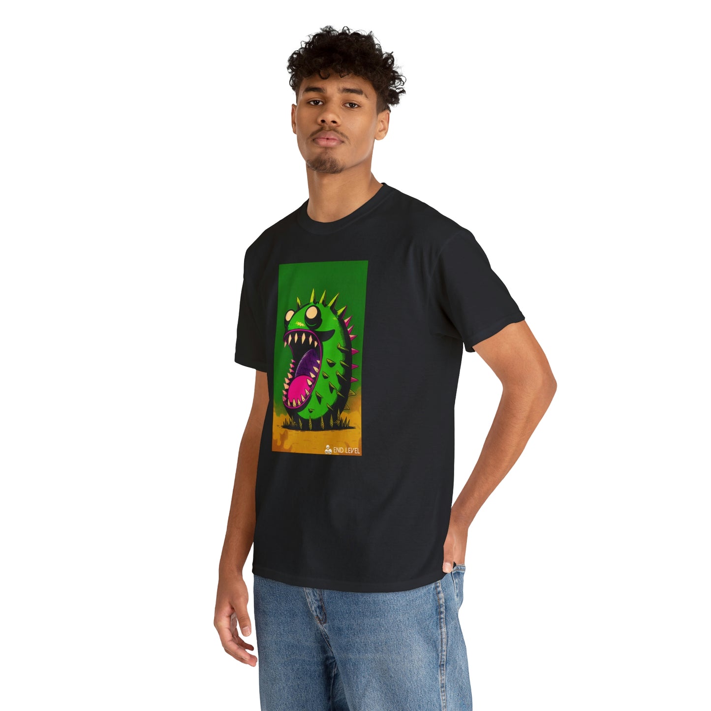 Man wearing Mighty Zook black tee with hand in back pocket.