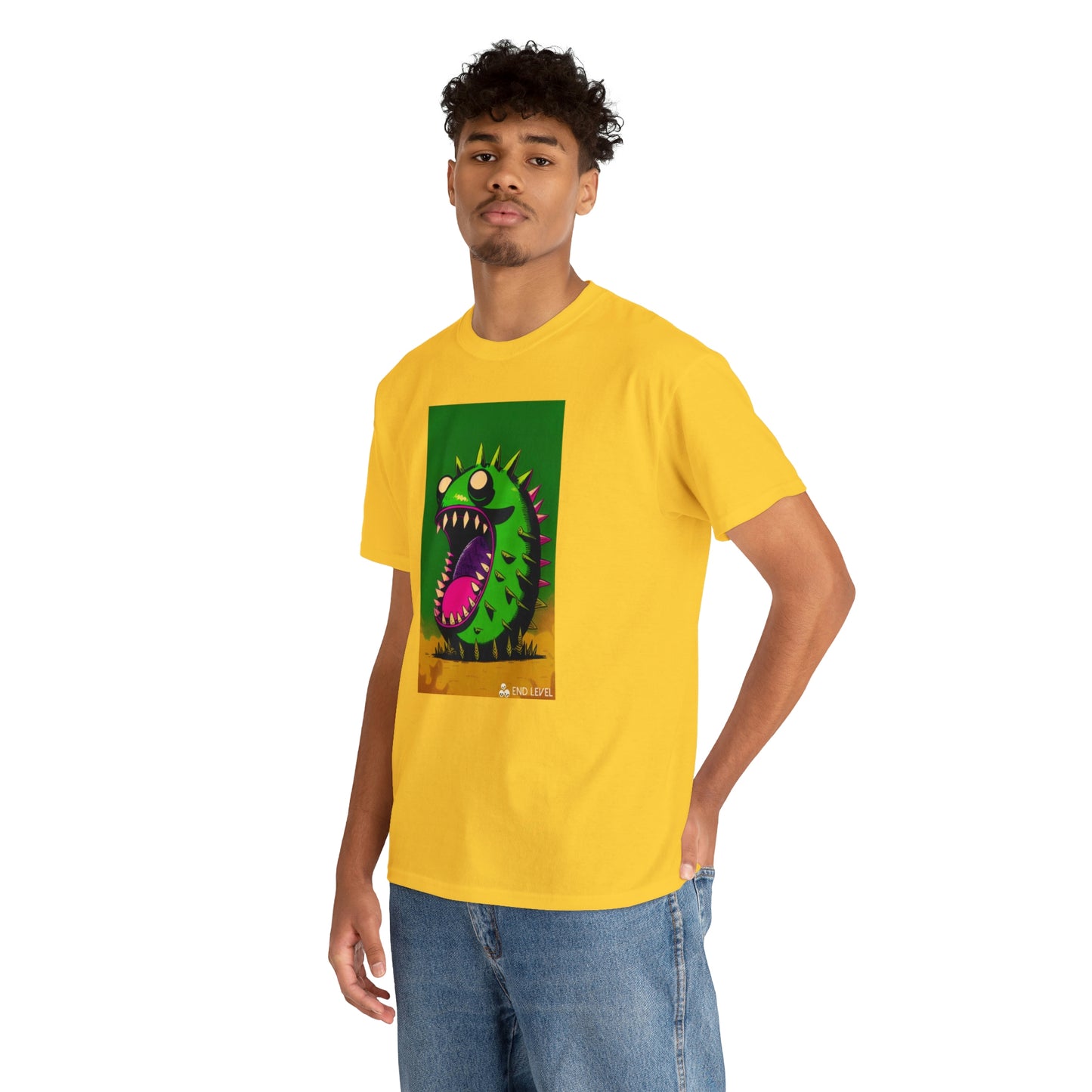 Man wearing Mighty Zook yellow tee with hand in back pocket.