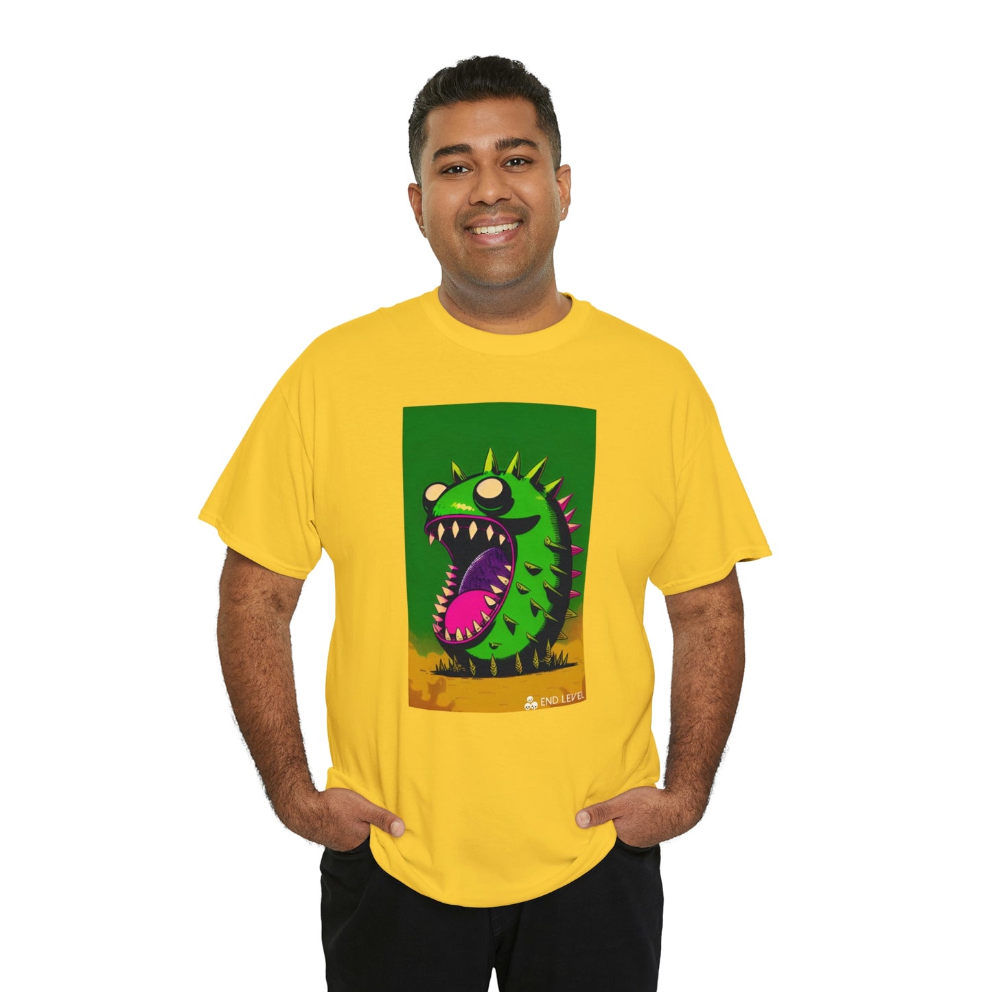 Man wearing Mighty Zook yellow tee with hands in pockets.