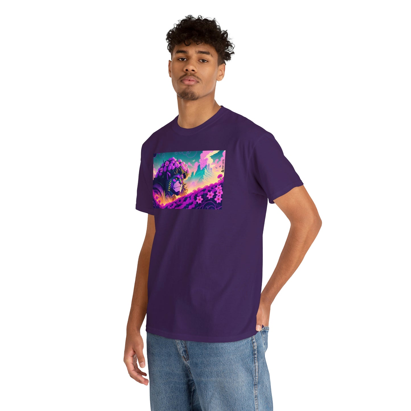 Man wearing purple King Blossom tee with hand in back pocket.