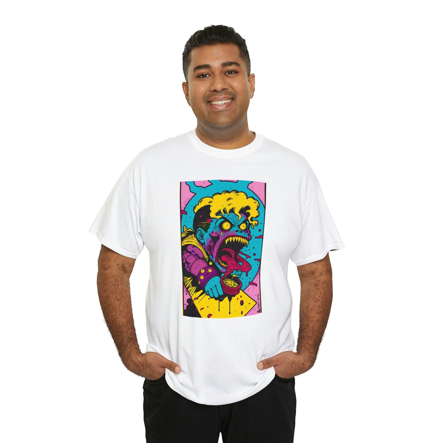 Man wearing white Eat Yo Veggies tee with hands in pockets.