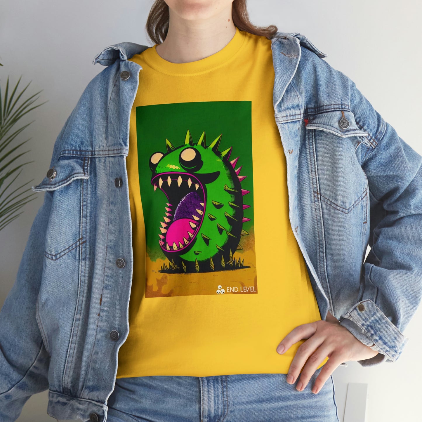 Woman wearing Mighty Zook design yellow tee with hand on hip.