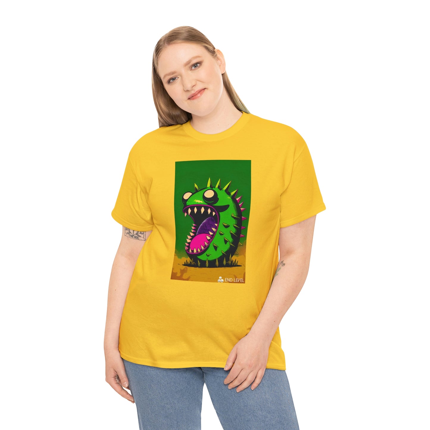 Woman wearing Mighty Zook yellow tee with hand on right side.