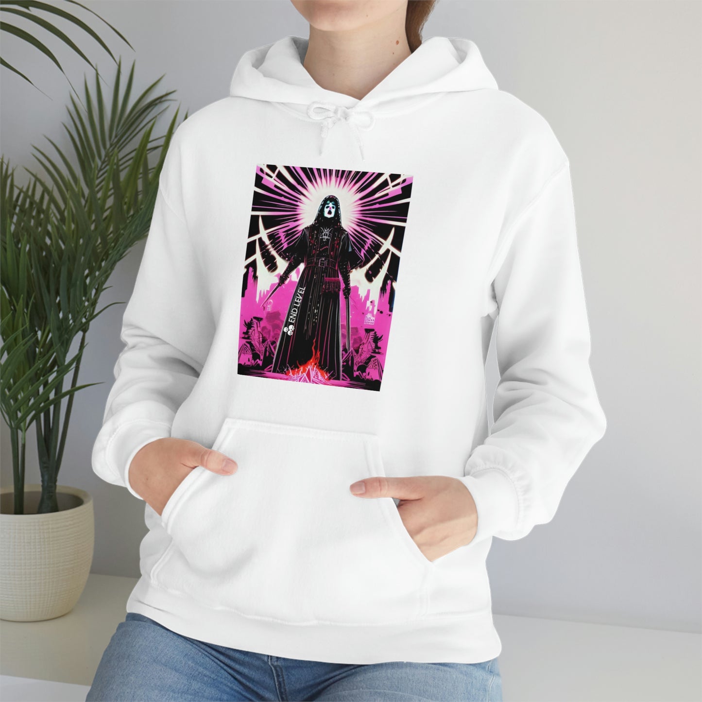 Woman sitting beside plant wearing white Necro Dancer hoodie.