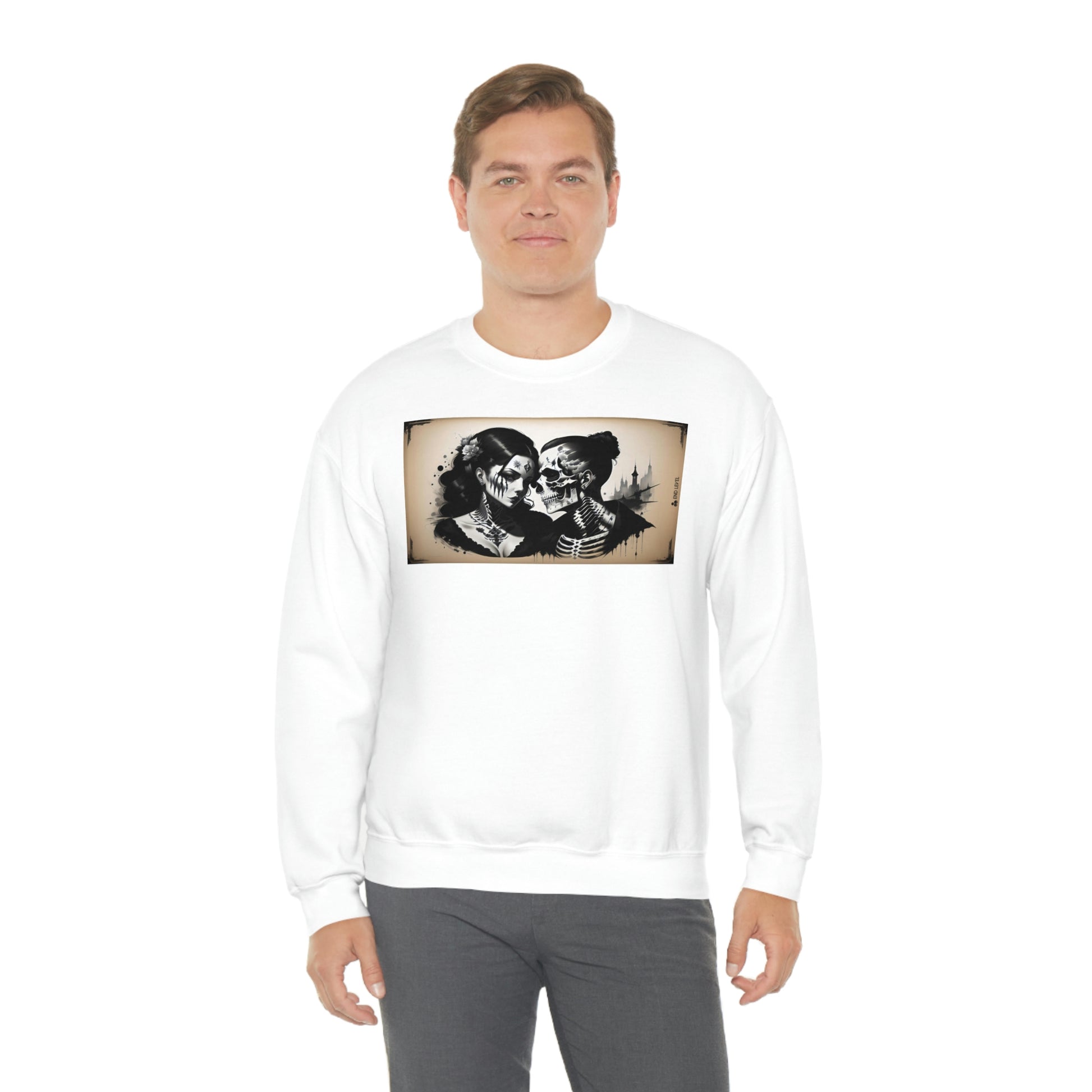 Man wearing Love Eternal white sweatshirt with grey pants.