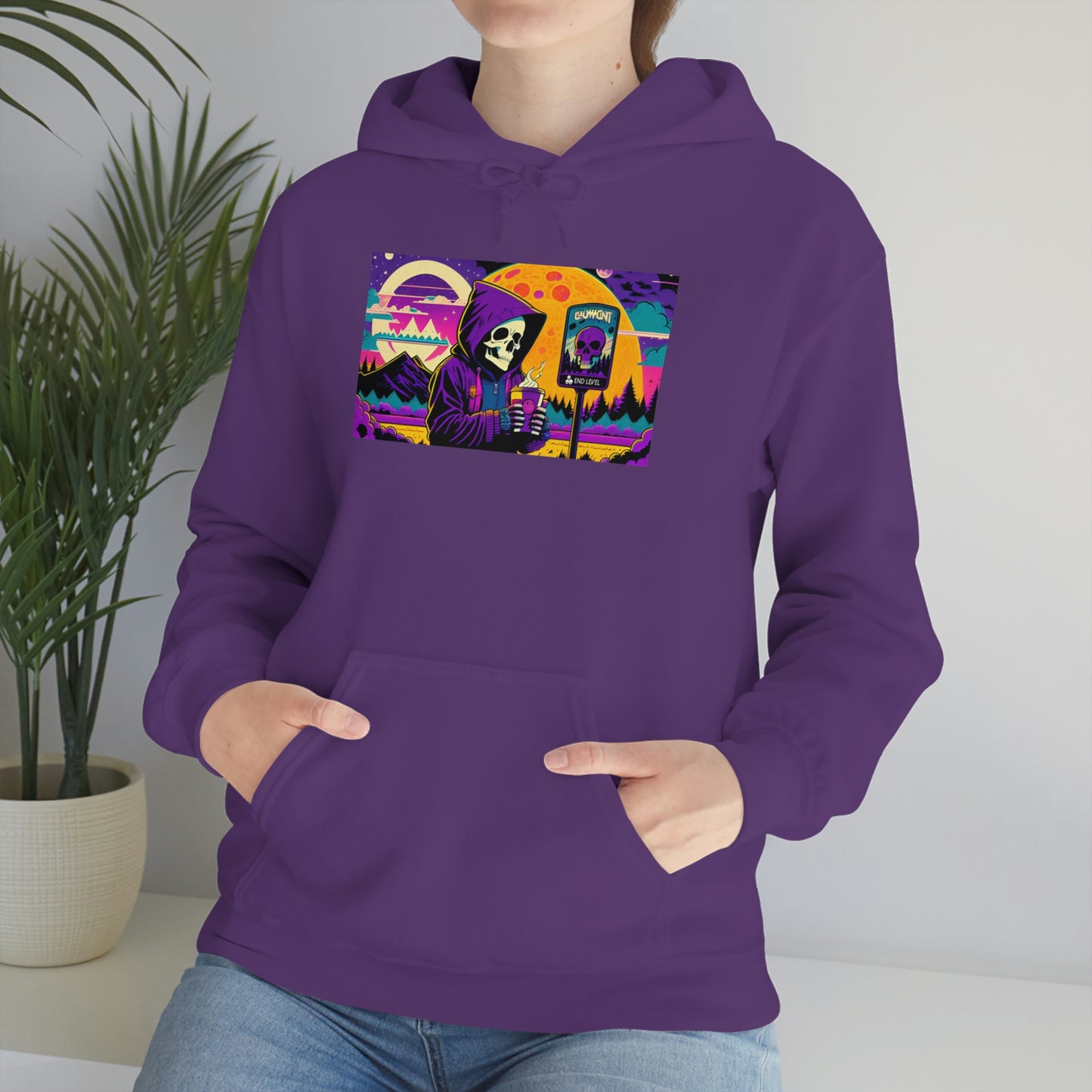 Woman with hands in purple death and coffee hoodie pouch beside plant.