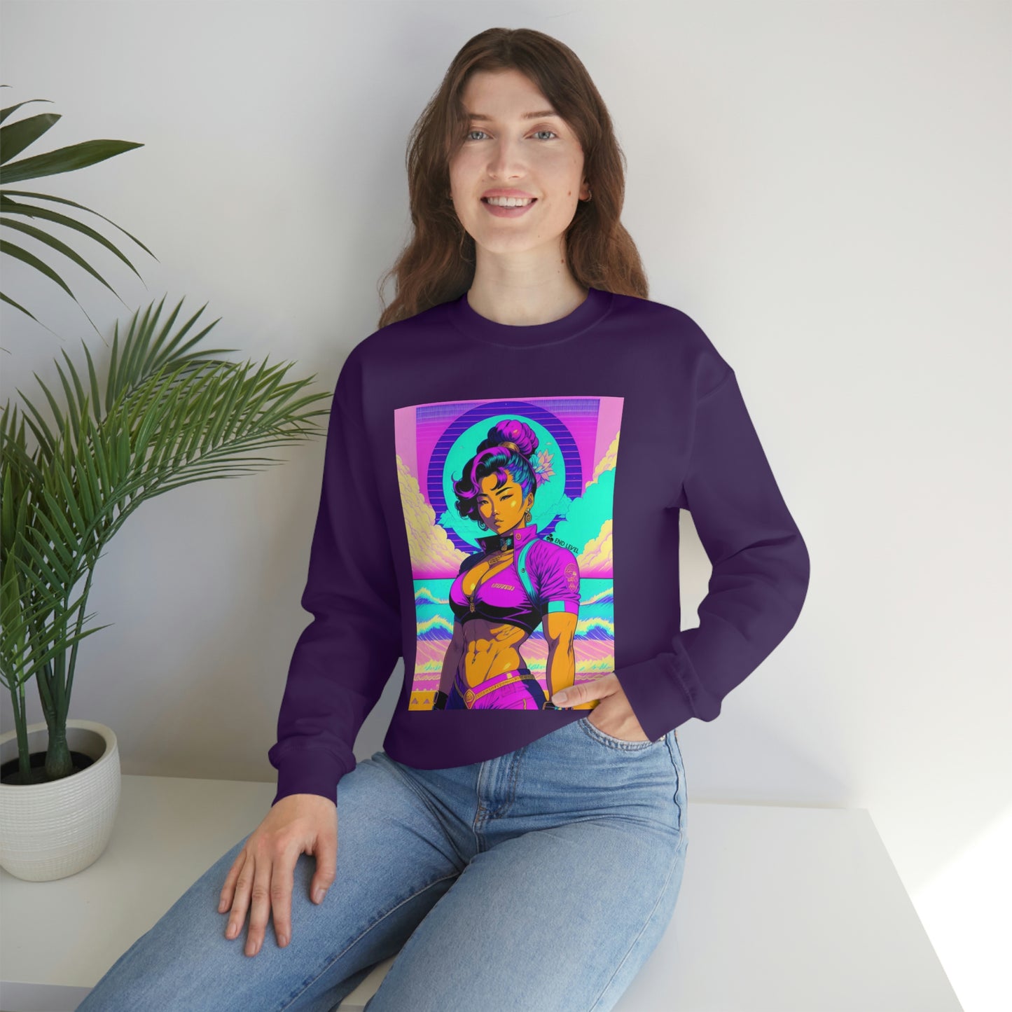 Woman with hand in jean pocket wearing purple Lady Lotus sweatshirt beside plant.