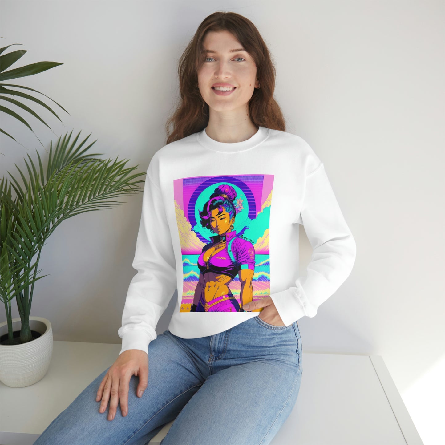 Woman with hand in jean pocket wearing white Lady Lotus sweatshirt beside plant.